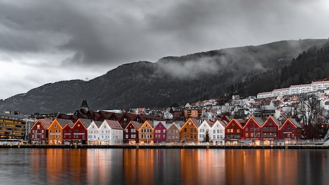 a view of Norwegian houses and the Seven Mountains