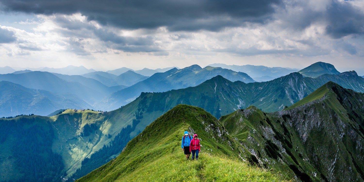 tow person walking through the mountain